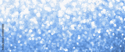 Classic blue 19-4052 color blurred glitter background. Sparkling and shiny texture for Christmas and New Year holiday or seasonal wallpaper decoration