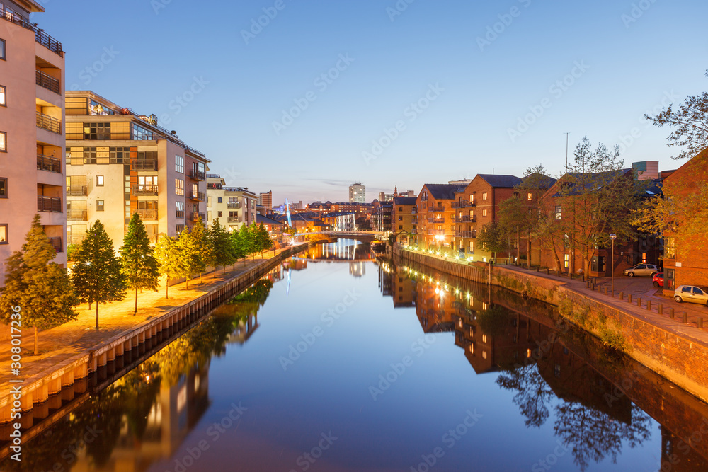 Buildings along the River Aire with Crown Point Bridge in the distance, Leeds, West Yorkshire, England, UK
