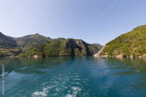 Beautiful landscape with mountains and green forests on a boat trip on the Komani lake in the dinaric alps of Albania