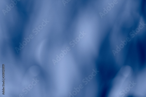 Abstract blured background with beautiful blue shades with frame. Modern photo of nature with shallow depth of field.