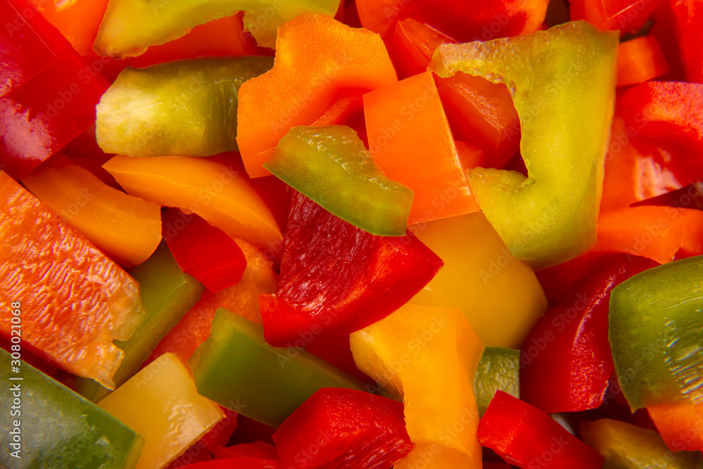 Sliced colored bell peppers on a plate. Vitamin healthy food. Sliced colored bell peppers on a plate. Vitamin healthy food.