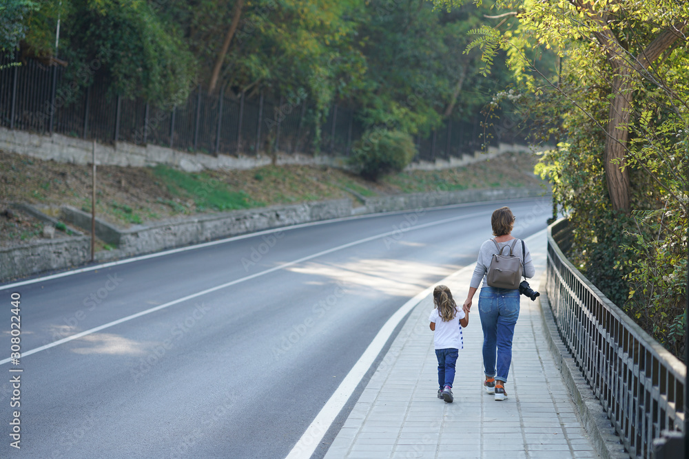 a mom and daughter walking in the streets of Veliko Tarnovo