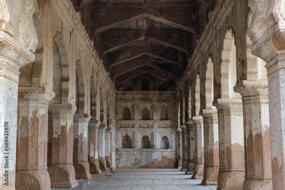 The pillars, arches and architectural detail inside a hall in the Raja Mahal, the palace of the Bundela Rajputs.