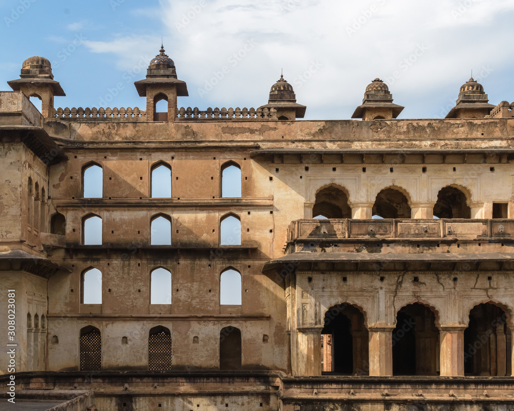 Orchha, Madhya Pradesh/India - March 14 2019: View of the multi-storeyed windowed walls of Raja Mahal, the ancient palace of the Bundela Rajputs.