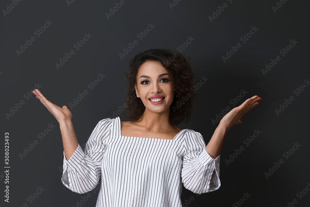 Emotional woman in casual outfit on black background Emotional woman in casual outfit on black background