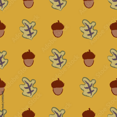 Acorns and leaves on a golden background
