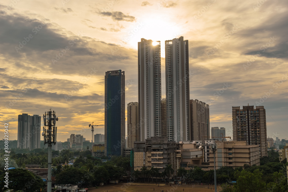 Mumbai, Maharashtra, India - October 2019: A cityscape with the high rises of Thakur Village and the clouds of the evening sky in the suburb of Kandivali East.