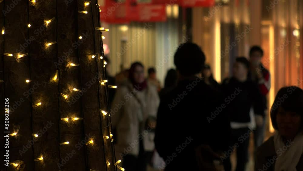 TOKYO, JAPAN - DECEMBER 2019 : Christmas illumination at Omotesando and Harajuku shopping area. Scenery of downtown city and streets in winter season. Led lights on roadside trees at night. TOKYO, JAPAN - DECEMBER 2019 : Christmas illumination at Omotesando and Harajuku shopping area. Scenery of downtown city and streets in winter season. Led lights on roadside trees at night.