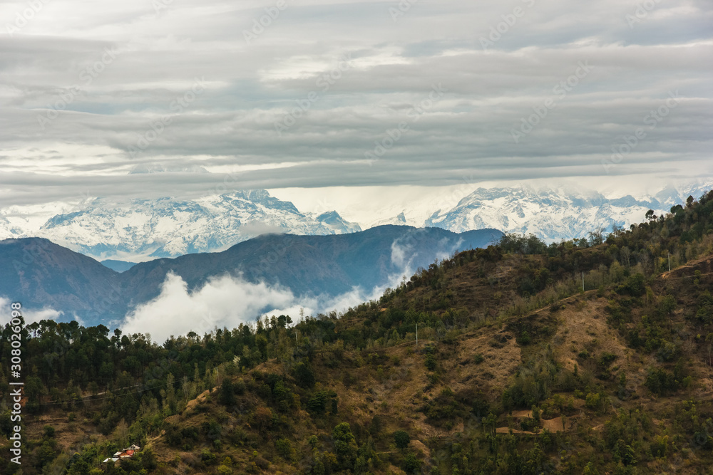 A beautiful view of the clouds swarming around the Annapurna range from the town of Tansen in Nepal.