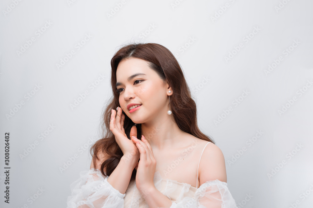Closeup beautiful young asian woman face isolated on white Closeup beautiful young asian woman face isolated on white