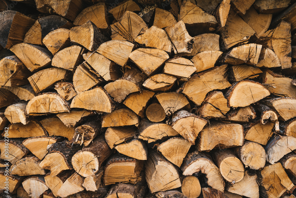 A heap of woodpile. Chopped wood. Firewood. A heap of woodpile. Chopped wood. Firewood.