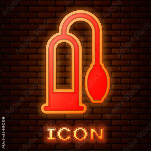 Glowing neon Penis pump icon isolated on brick wall background. Penis enlarger. Sex toy for men. Vacuum pump with a blower to increase the penis.  Vector Illustration