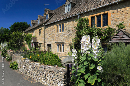 Summer view over Honey-Coloured Cottages, Lower Slaughter village, Gloucestershire Cotswolds, England, UK