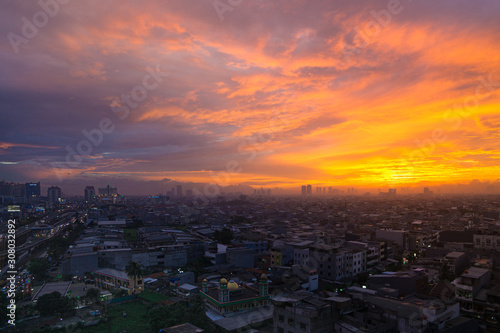 sunset over the city © Fanyanto