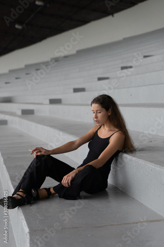 Beautiful girl smokes a cigarette. Looks like an addict. Location Estonia, Tallinn