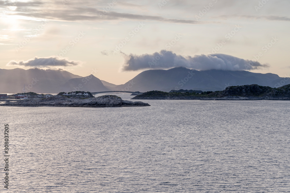 bridge and cliffs at fake-sunset in fjord, Henningsvaer, Lofoten, Norway