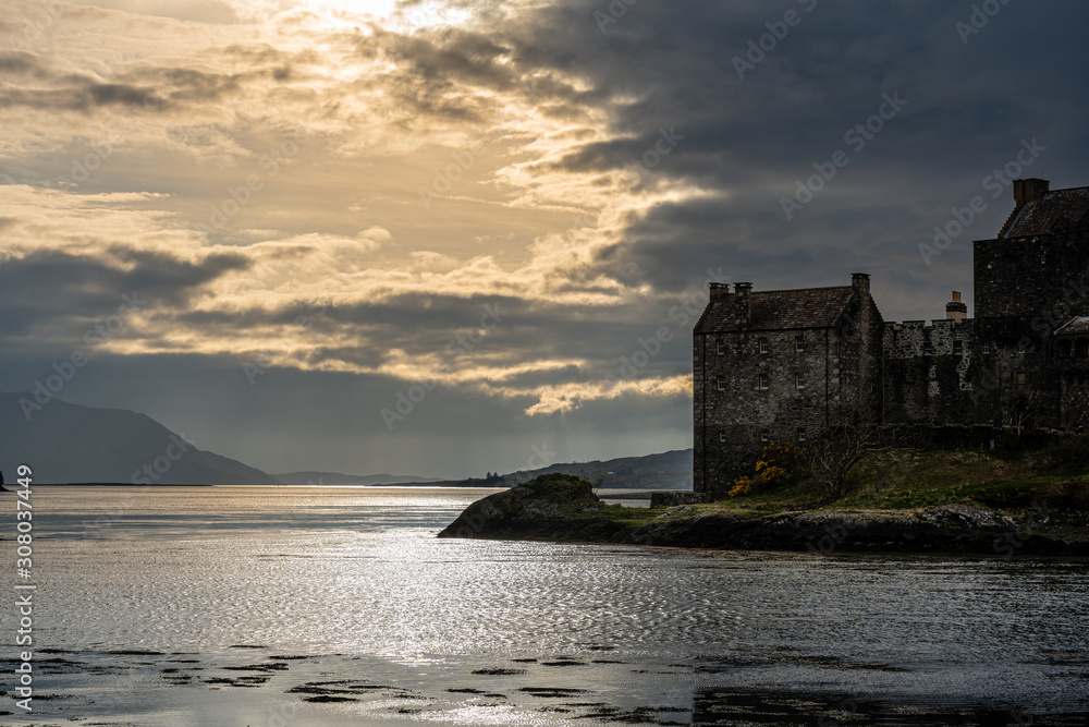 Cloudy sunset at Eilean Donan Castle, Scotland, UK, on the last day of October