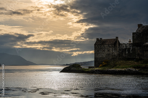 Cloudy sunset at Eilean Donan Castle, Scotland, UK, on the last day of October