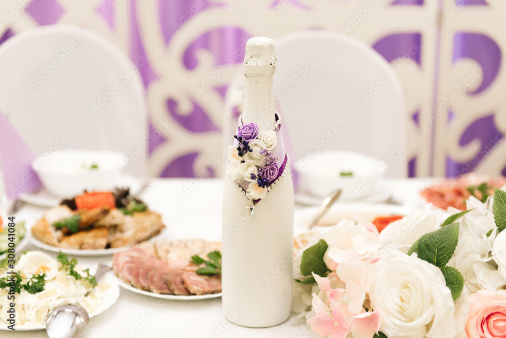The concept of decor for weddings and holidays, floral arrangements on the tables, the Presidium of the newlyweds in purple