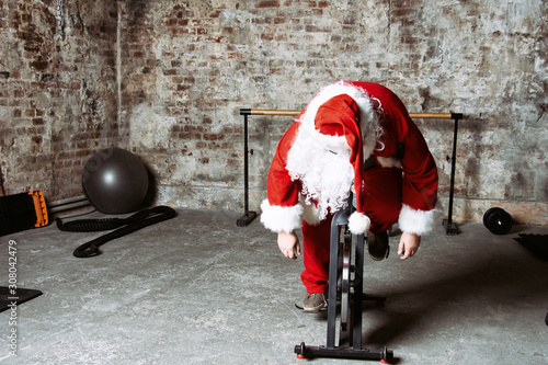 Fitness. Funny Santa Claus and gym.