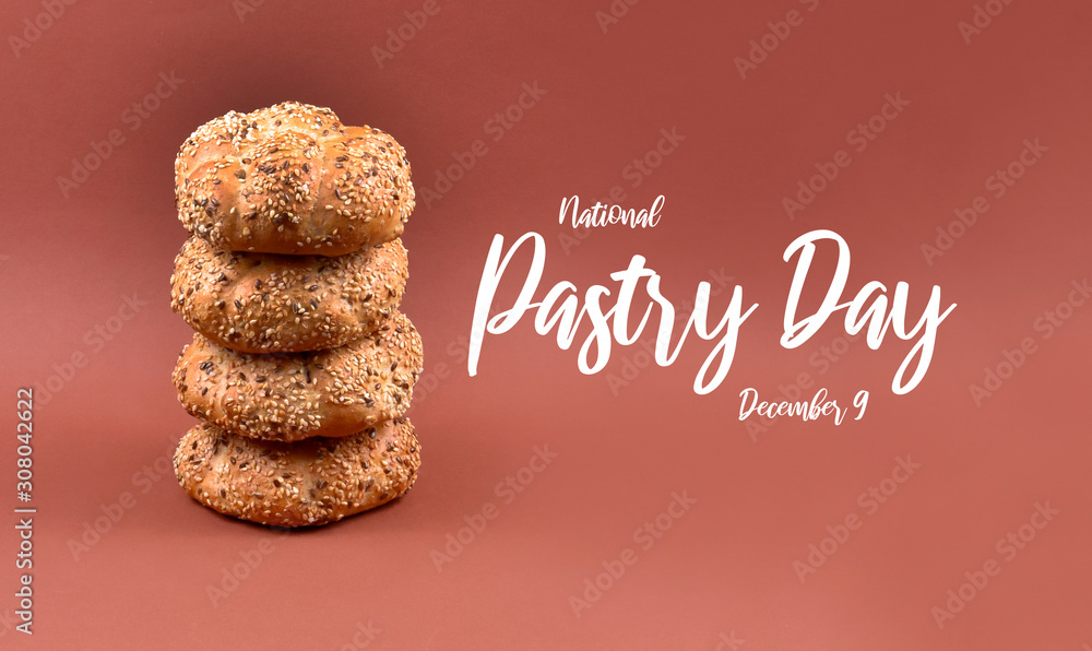National Pastry Day. Pile of bread stock images. Croissant and wholemeal bun isolated on a brown