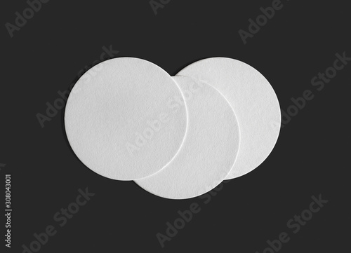 Three blank beer coasters on gray background. Flat lay.
