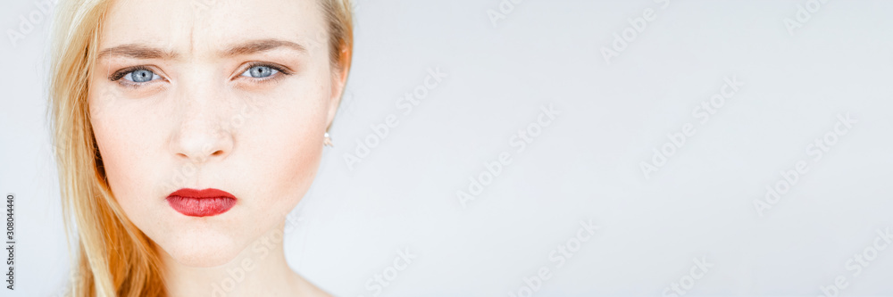 Anger, offence. Annoyed, mad, disappointed woman Smooth face skin red lips Anger, offence. Annoyed, mad, disappointed woman Smooth face skin red lips