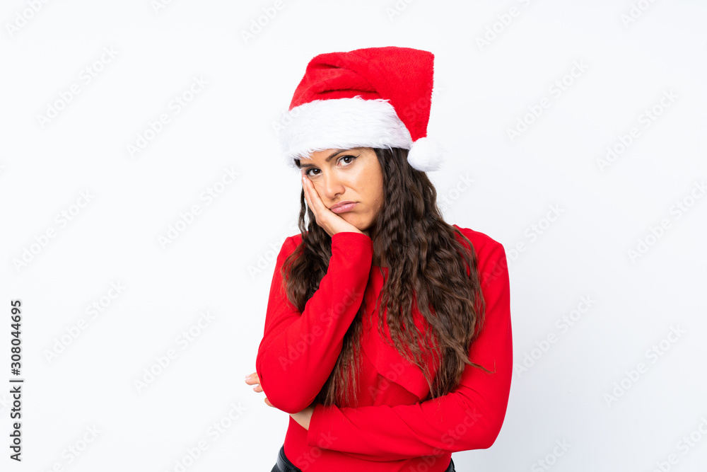 Girl with christmas hat over isolated white background unhappy and frustrated Girl with christmas hat over isolated white background unhappy and frustrated