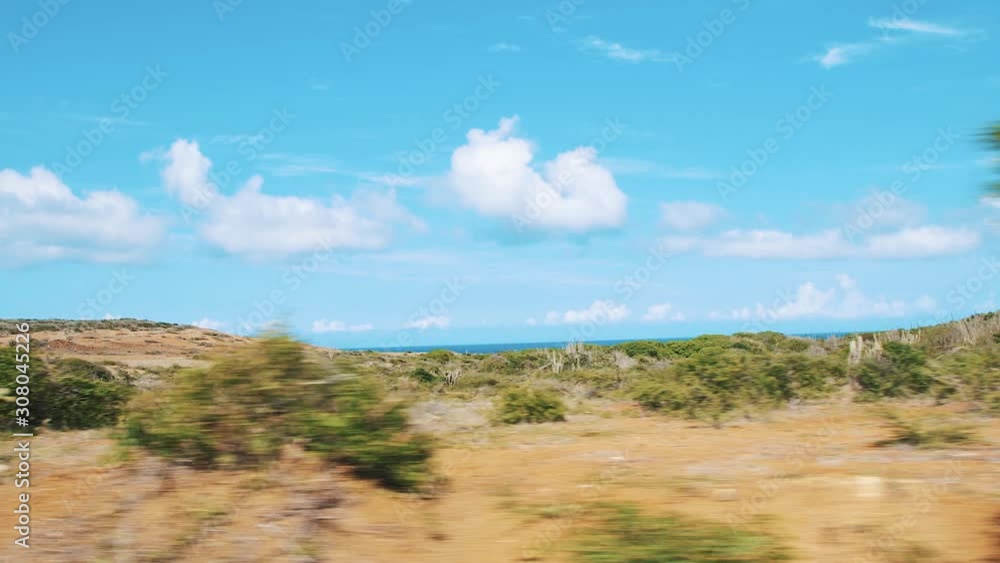 Driving Through The Dry Land Landscape Of Curacao - Wide Moving Shot Driving Through The Dry Land Landscape Of Curacao - Wide Moving Shot