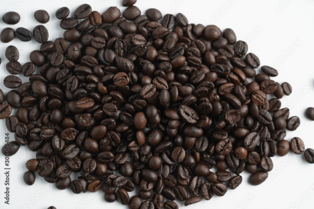 pile black coffee bean top view with white background pile black coffee bean top view with white background