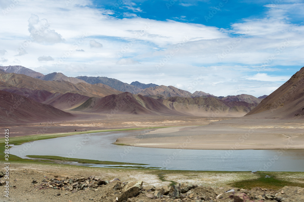 Ladakh, India - Jul 13 2019 - Indus River view from Between Maha and Nyoma in Ladakh, Jammu and Kashmir, India. Ladakh, India - Jul 13 2019 - Indus River view from Between Maha and Nyoma in Ladakh, Jammu and Kashmir, India.