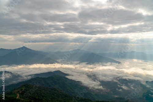 On a foggy day, there was a mountainous landscape. Northern Thailand during the cold season.