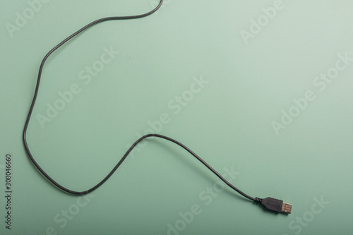 USB cable on a green background