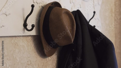 Hanging Up Hat and Coat on an Antique Rack