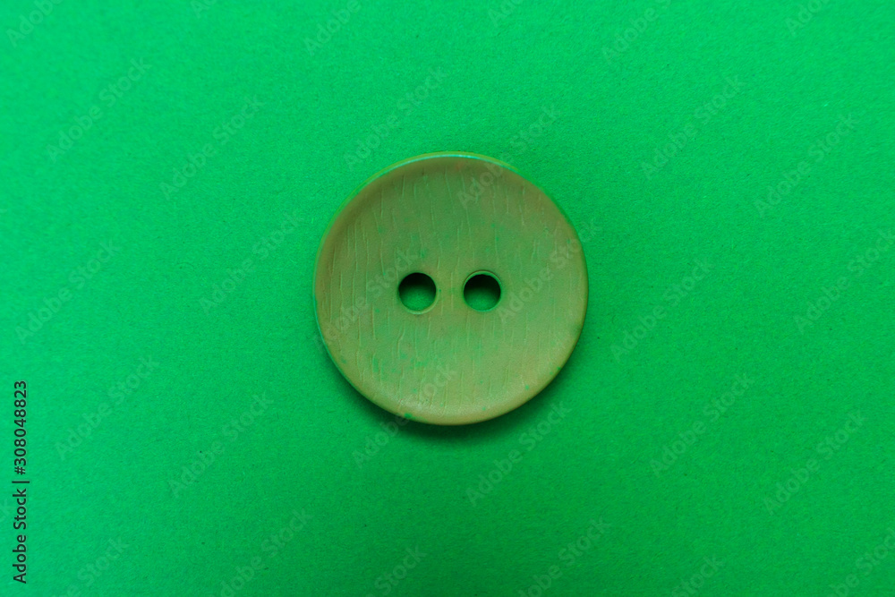 Big green button isolated on a green background. Big green button isolated on a green background.