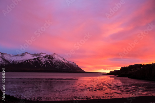 Dramatic sunset over the mountains and the sea in Iceland