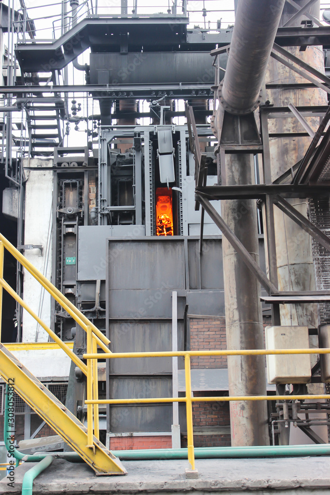 Iron production in factory. Red hot molten iron produced in iron factory
