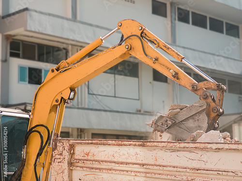 Bulldozer Removes the debris from demolition on the construction site
