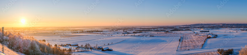 Panoramic view at a scenics winter landscape at sunset