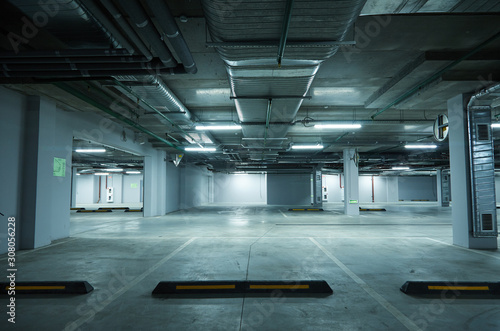 Horizontal image of empty underground parking lot © strixcode