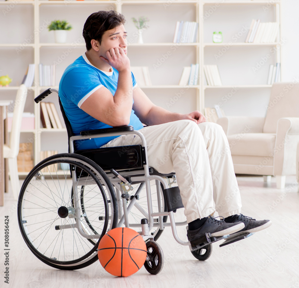 Young basketball player on wheelchair recovering from injury Young basketball player on wheelchair recovering from injury