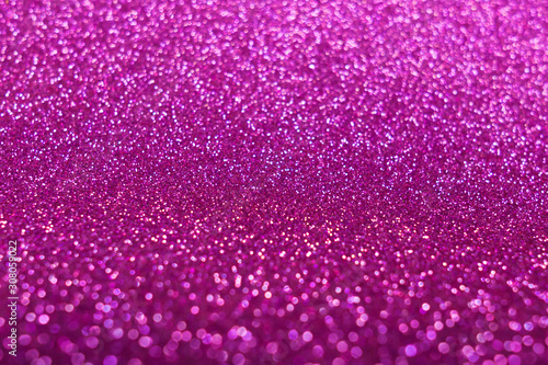 Blurred shining closeup of magenta gold texture