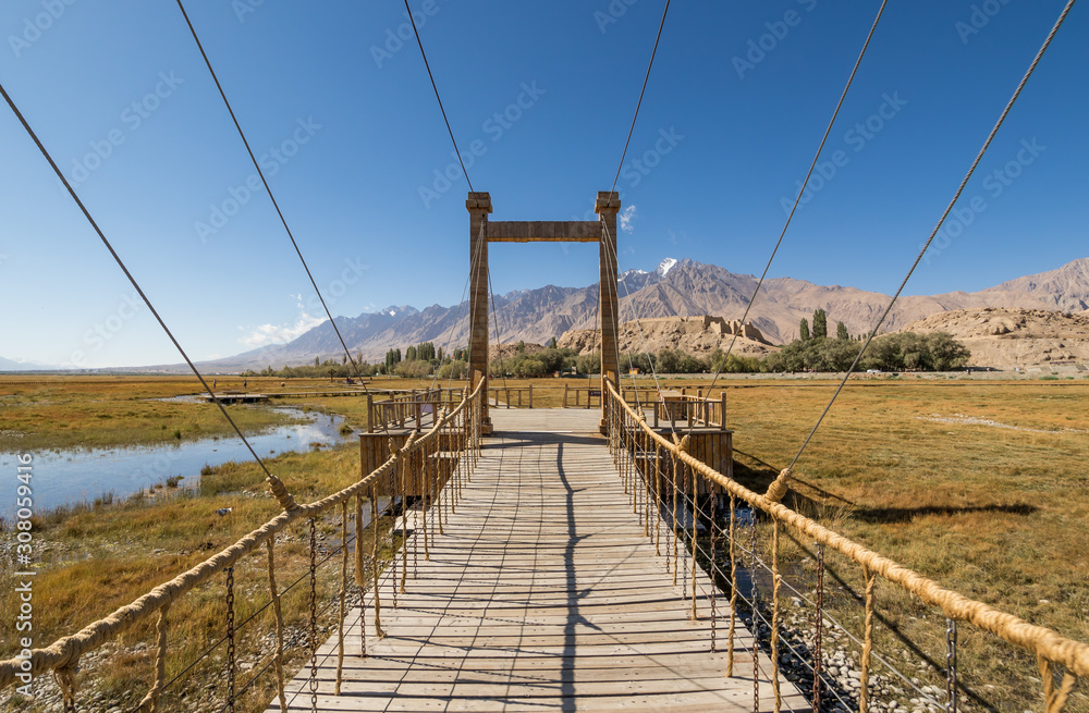 Fototapeta premium Tashkurgan is slowly becoming a tourist attraction with people coming from all over China. Here in particular some footboards to help people visiting the grassland