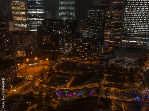 Aerial drone night shot of Parc Diderot with color lighted fountain with La Defense Skyscrapers in background photo