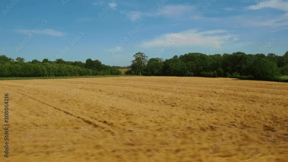 Passenger view of amazing croplands and rolling hills in the Cotswolds in England, UK, an Areas of Outstanding Natural Beauty Passenger view of amazing croplands and rolling hills in the Cotswolds in England, UK, an Areas of Outstanding Natural Beauty