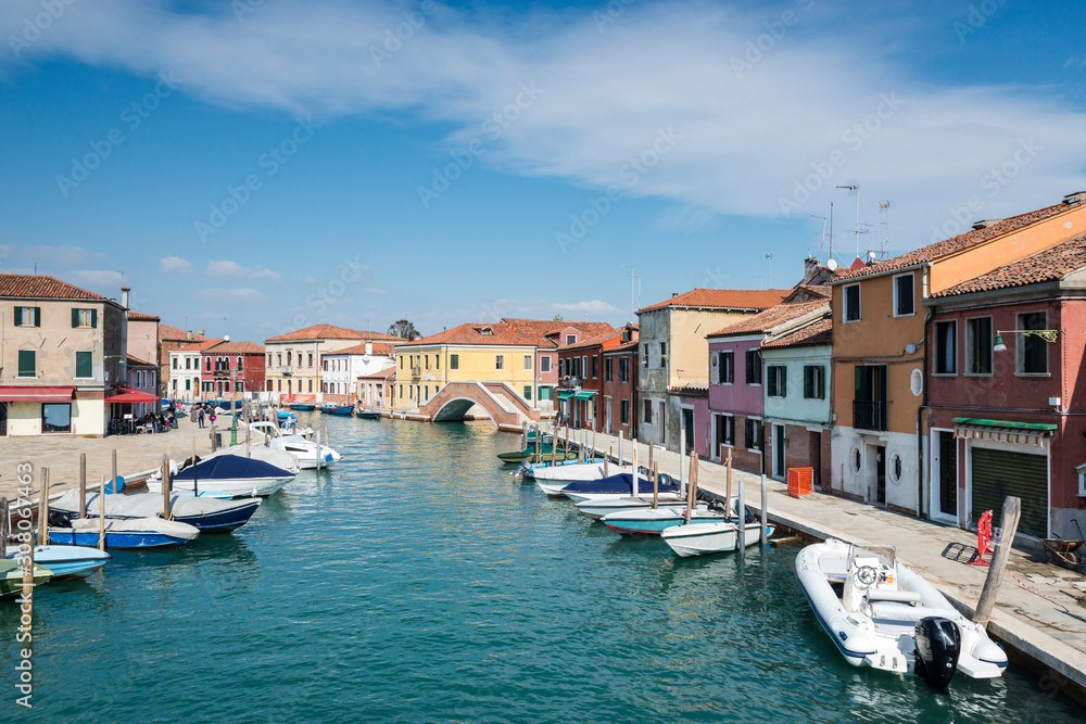Panoramic view of a channel, bridge and boats on Murano island,  Venice, Italy