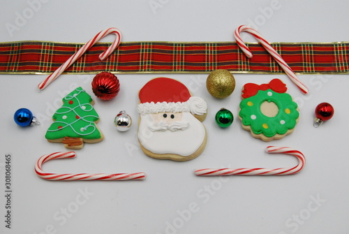 Five Christmas cookies made of iced gingerbead with Christmas decorations photo