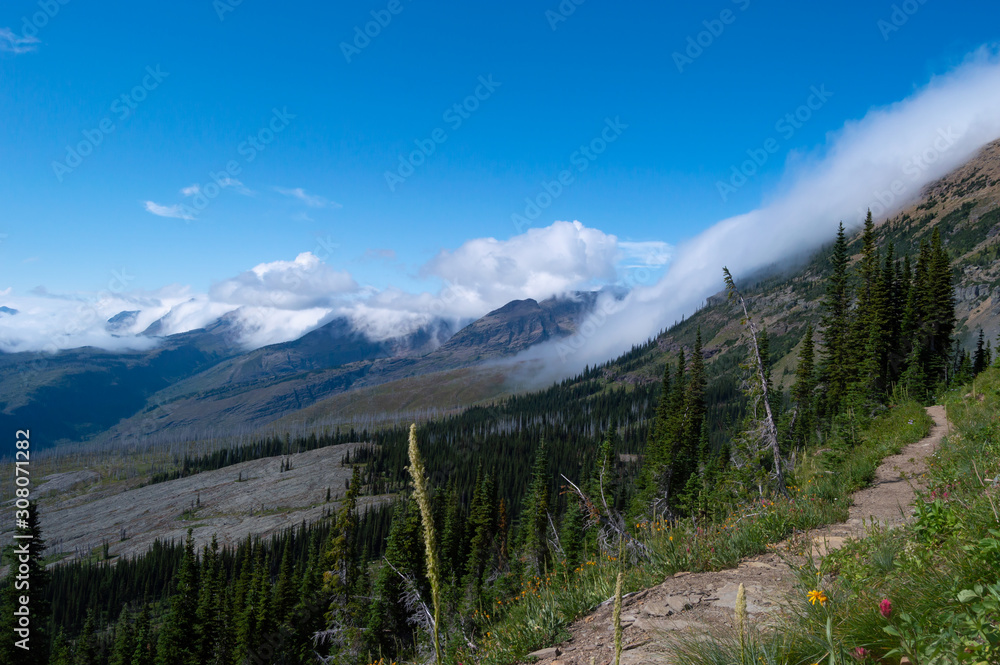 Fototapeta premium Clouds rolling over the mountains