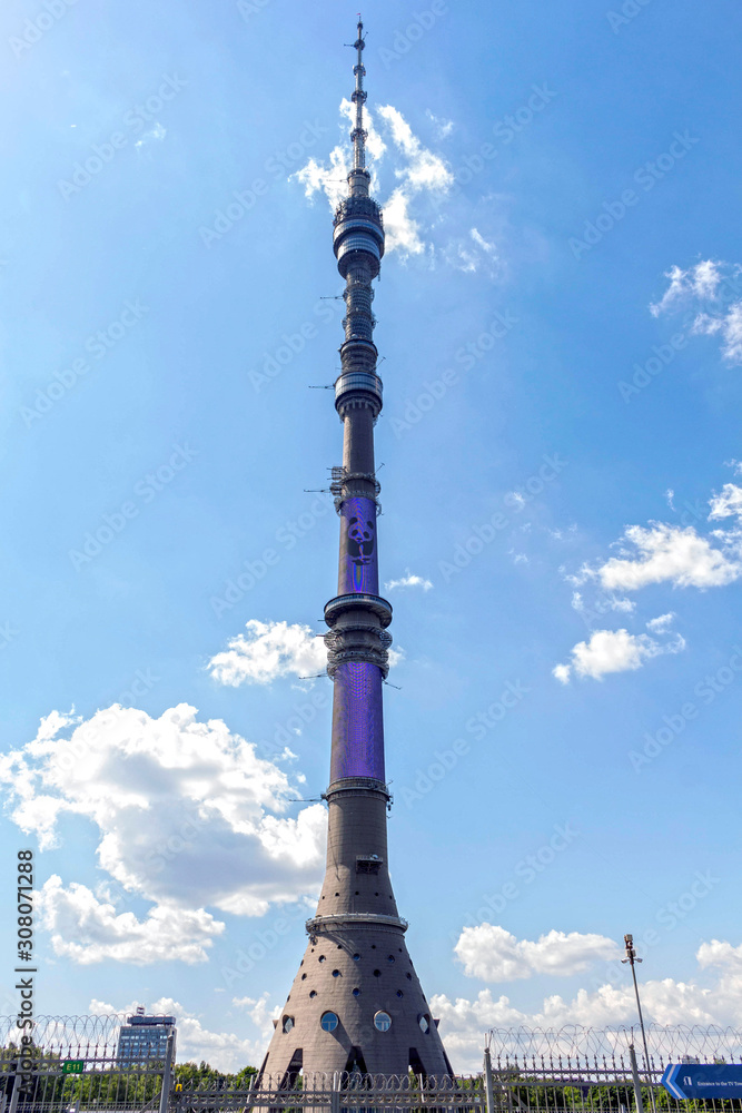 Obraz premium Ostankino TV tower on a background of blue sky with clouds