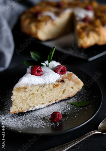 Apple pie with suger powder at dark background